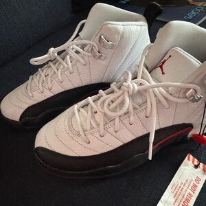 White and Black Sneakers with Red Accents